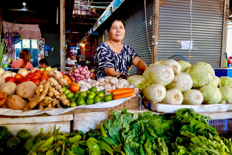 Vegetable vendor in a market in Siem Reap, Cambodia
