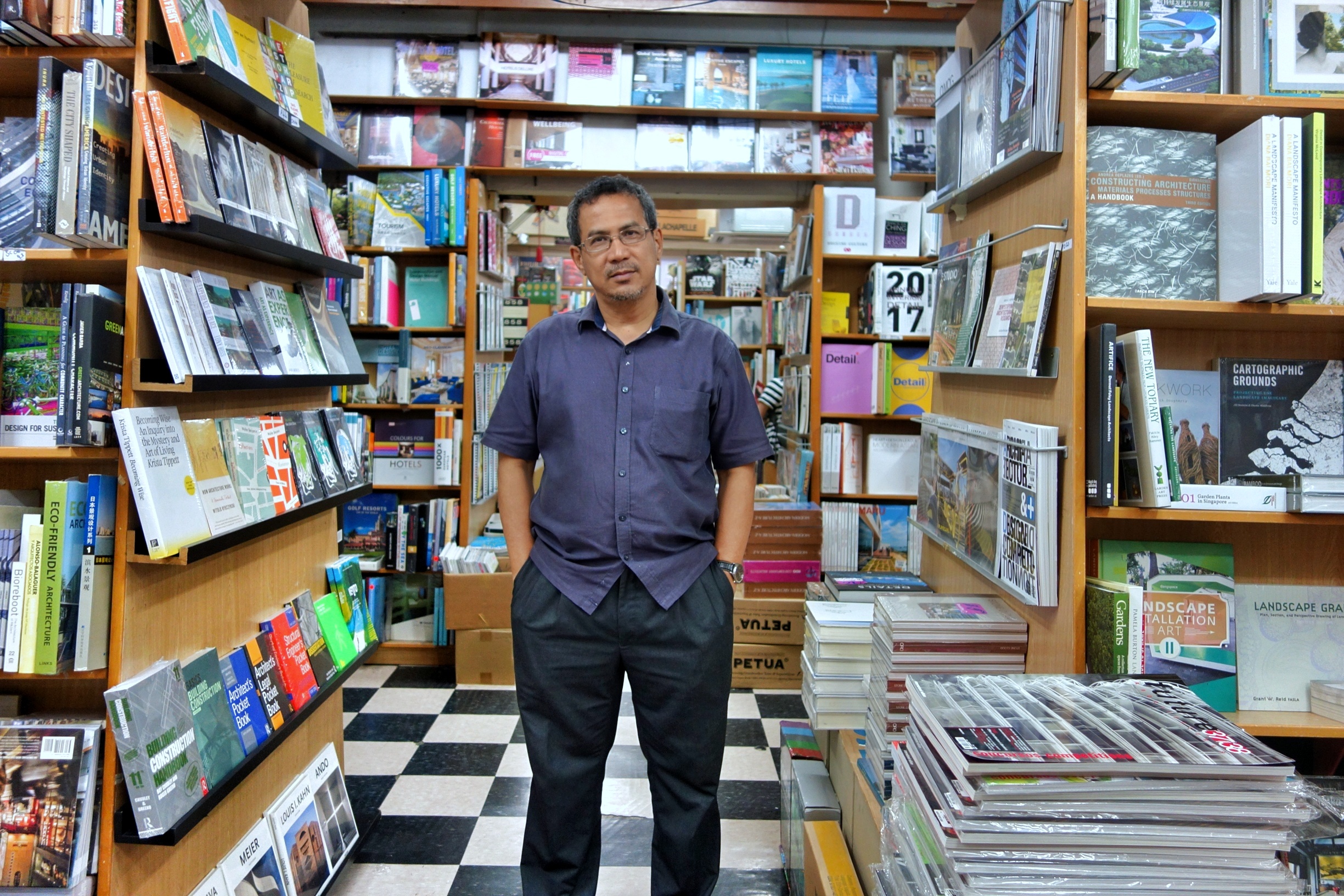 Basheer Graphic Books with the owner Abdul Nasser at Bras Basah Shopping Complex in Singapore - a bookshop series by Shopkeeper Stories | ShopkeeperStories.com