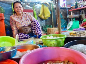 Market vendor selling prawns, cockles, eggs and tomatoes at a market in Siem Reap (Cambodia) – Shopkeeper Stories
